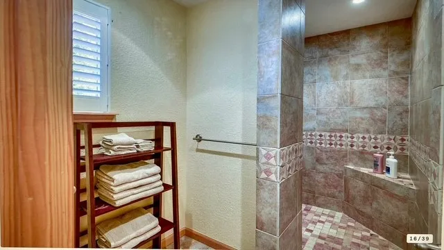 a bathroom with a bathtub and a shower