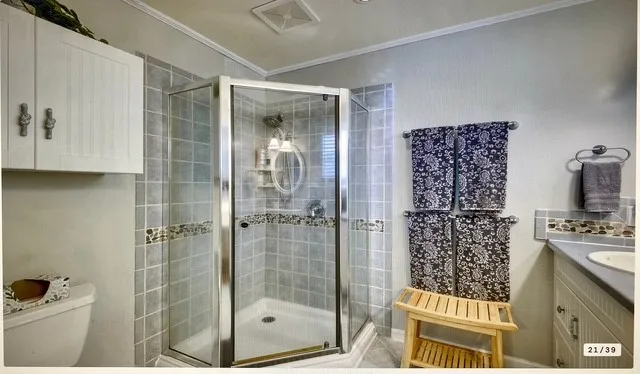 a bathroom with a shower and a sink