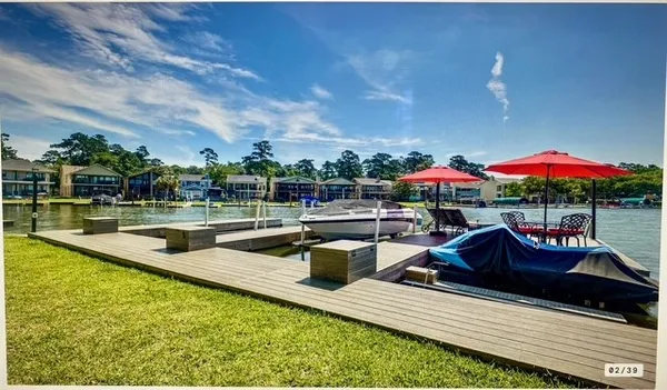 a view of swimming pool with outdoor seating