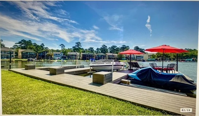 a view of swimming pool with outdoor seating