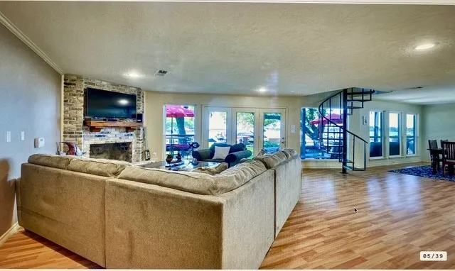 a living room with fireplace furniture and a flat screen tv