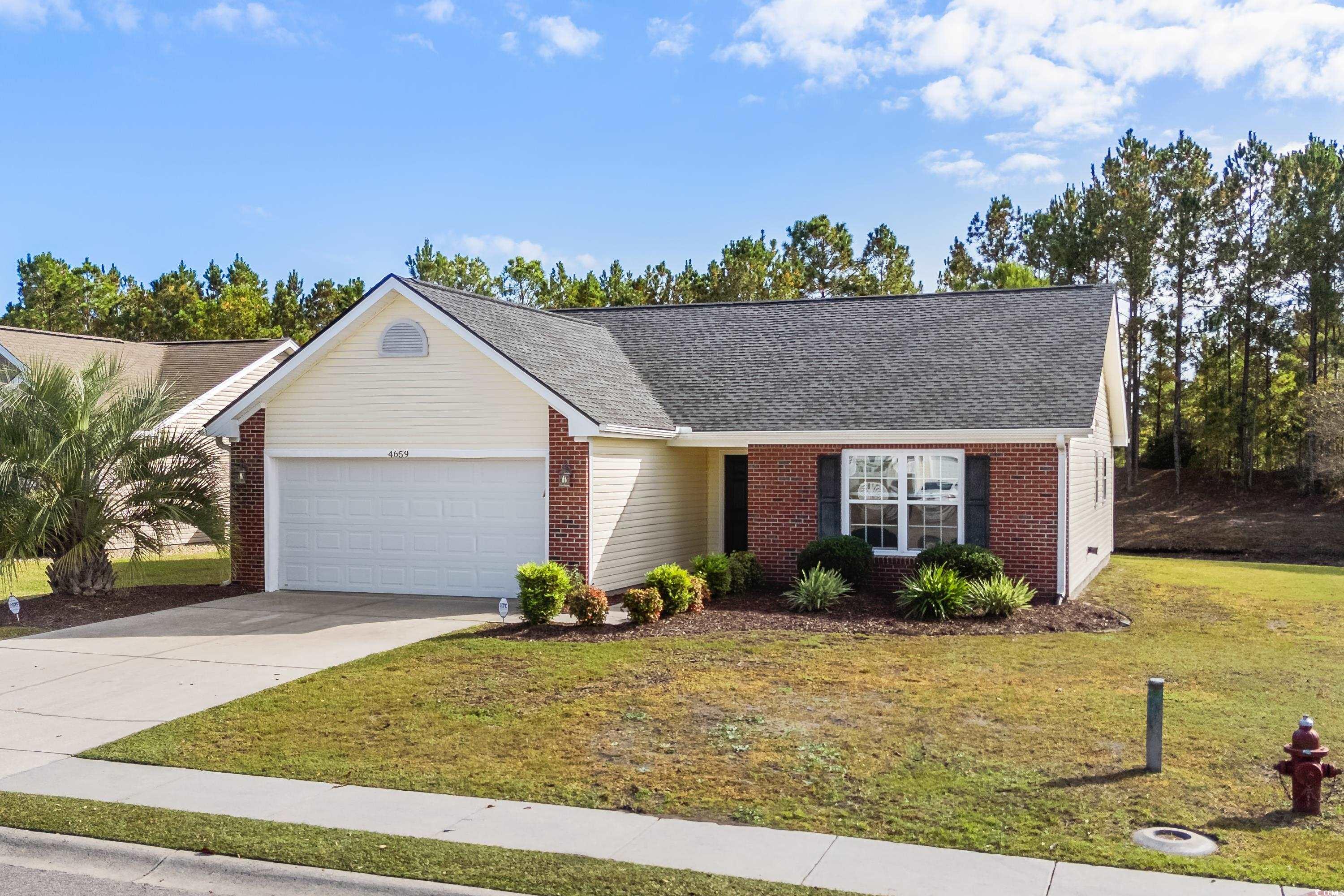 4659 East Walkerton Road Myrtle Beach, SC 29579 - Photo 40 of 40 Ranch-style house with a front lawn and a garage