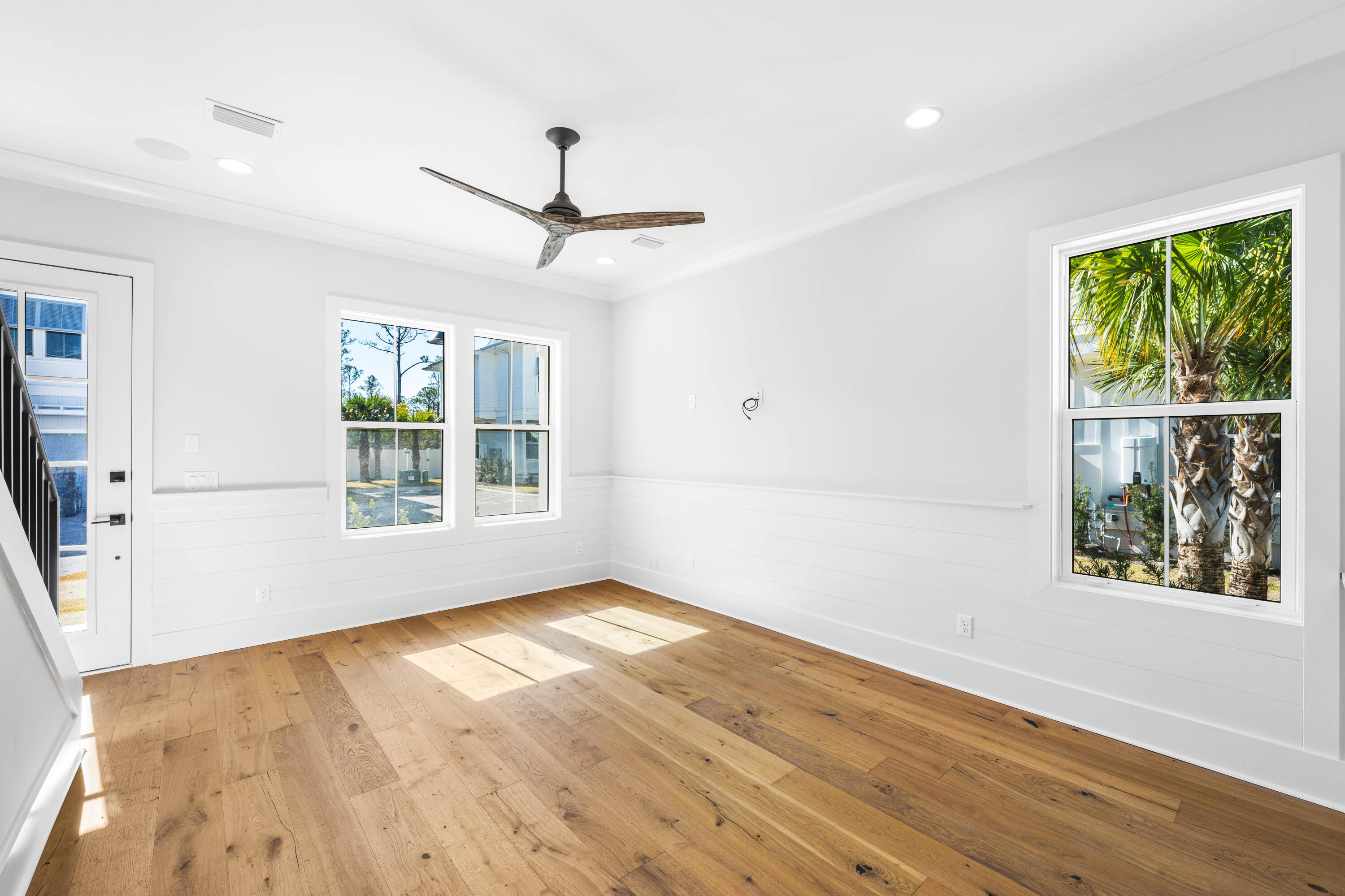 20 Casa Breeze Lane, Unit 20B Santa Rosa Beach, FL 32459 - Photo 15 of 41 a view of an empty room with wooden floor and a window