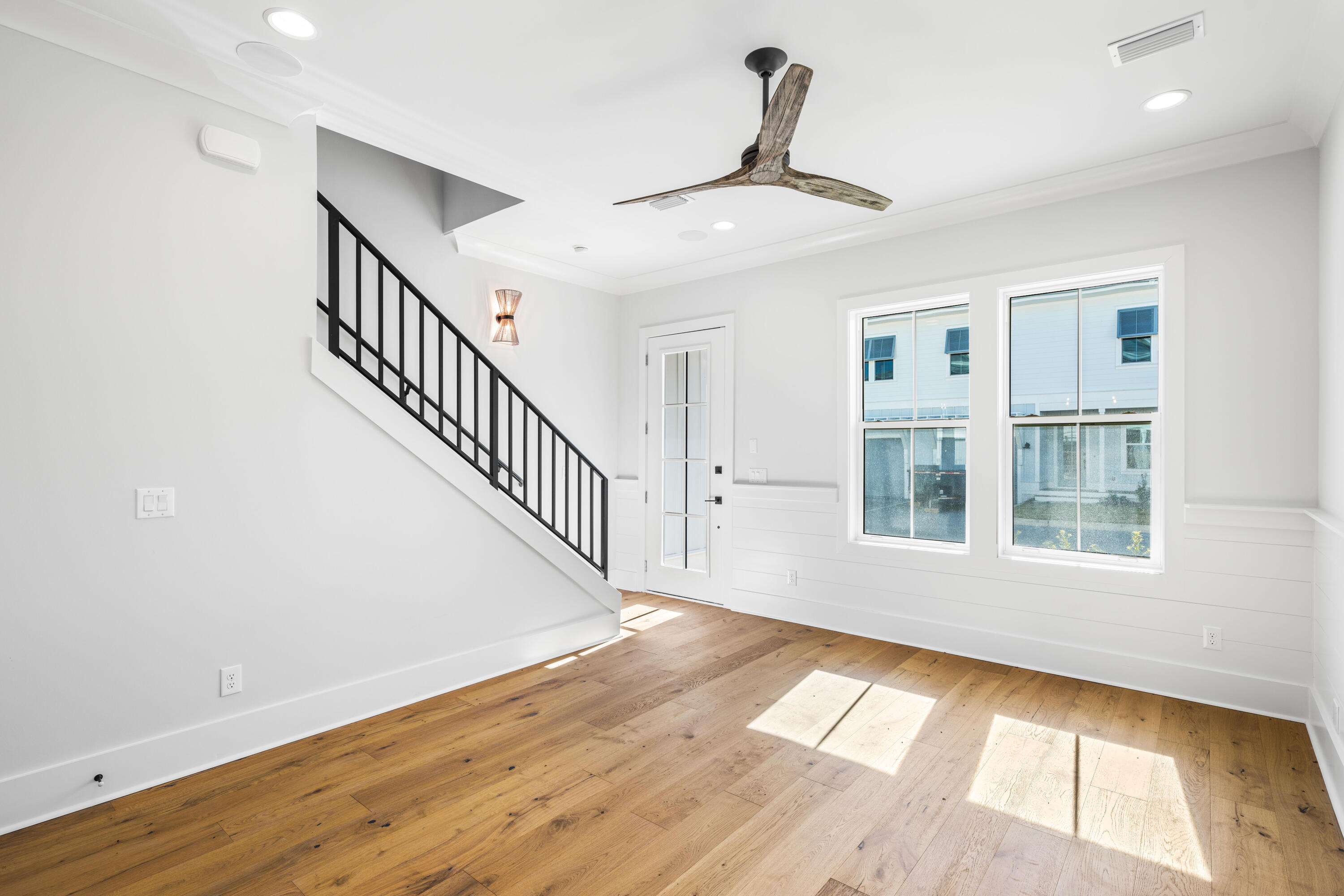 20 Casa Breeze Lane, Unit 20B Santa Rosa Beach, FL 32459 - Photo 16 of 41 a view of an empty room with wooden floor and a window