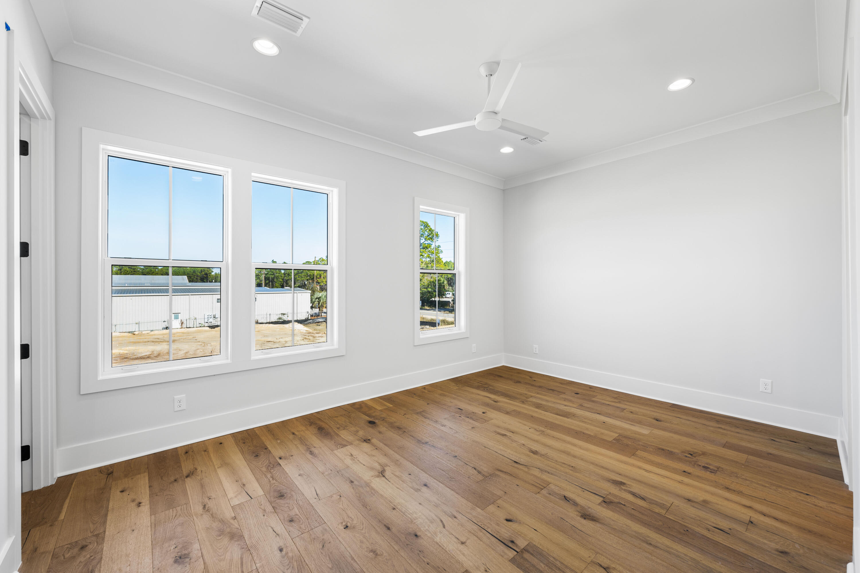 20 Casa Breeze Lane, Unit 20B Santa Rosa Beach, FL 32459 - Photo 22 of 41 an empty room with wooden floor and windows