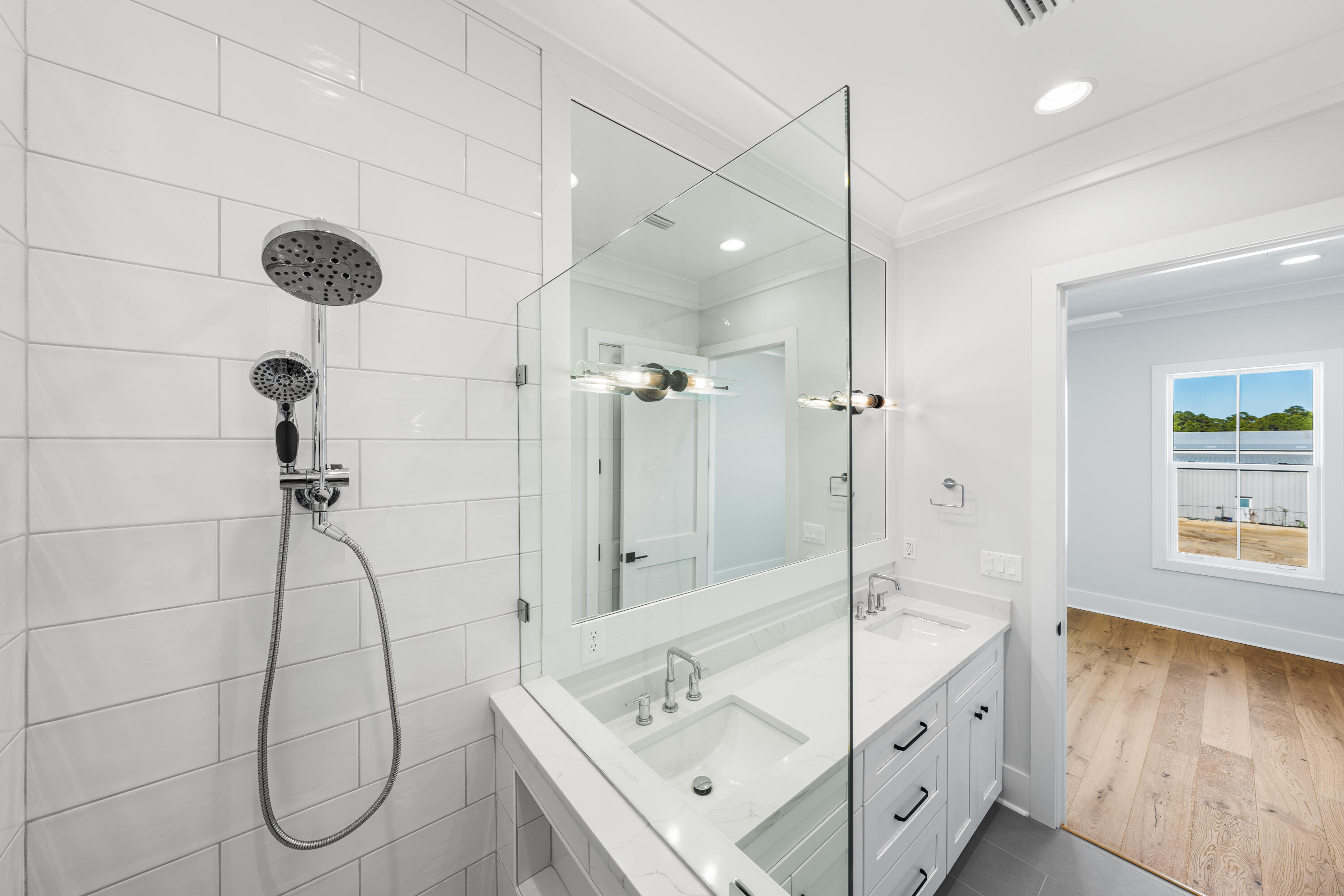 20 Casa Breeze Lane, Unit 20B Santa Rosa Beach, FL 32459 - Photo 27 of 41 a bathroom with a granite countertop sink a shower and mirror