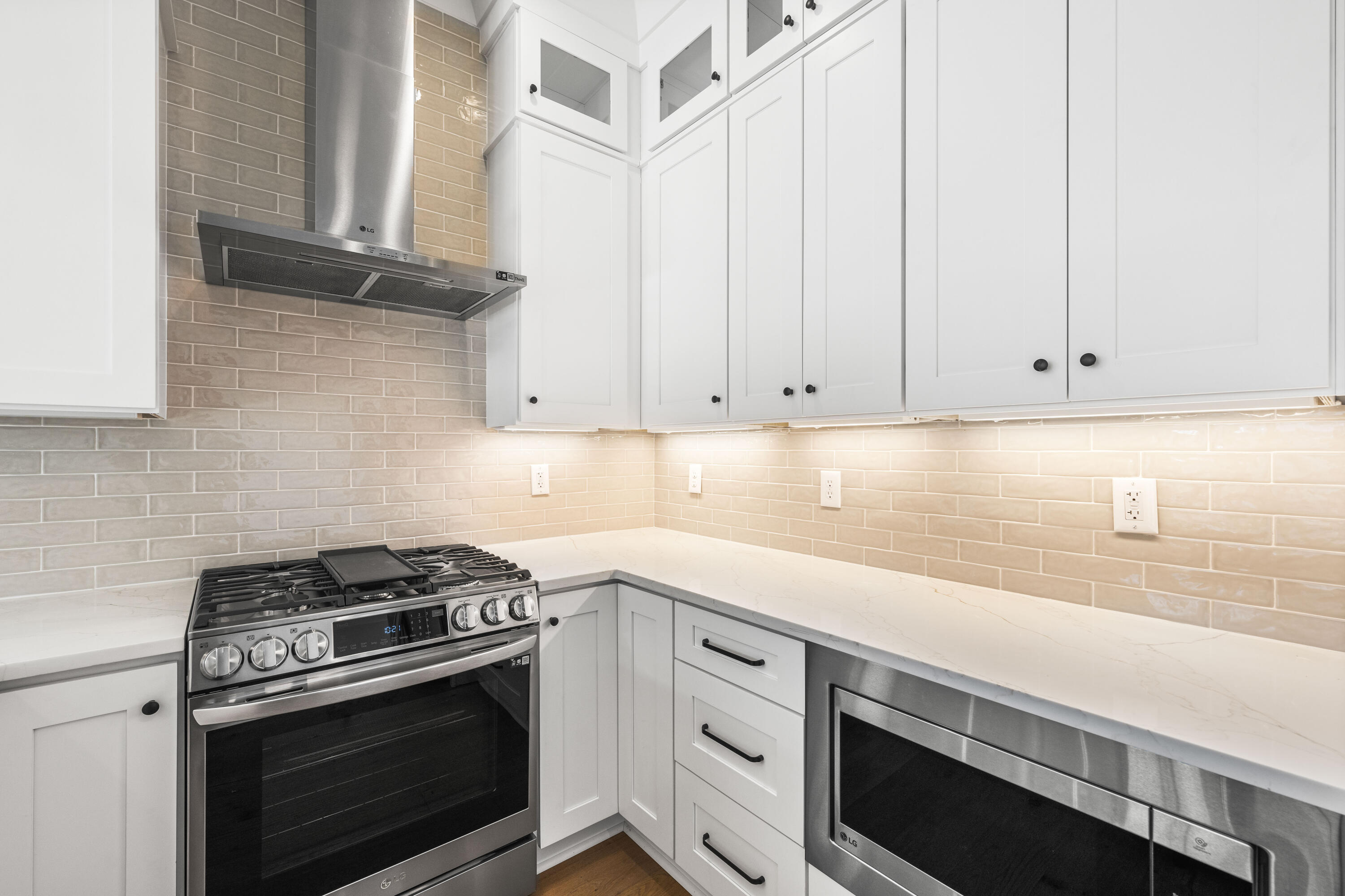 20 Casa Breeze Lane, Unit 20B Santa Rosa Beach, FL 32459 - Photo 4 of 41 a kitchen with granite countertop white cabinets and white appliances