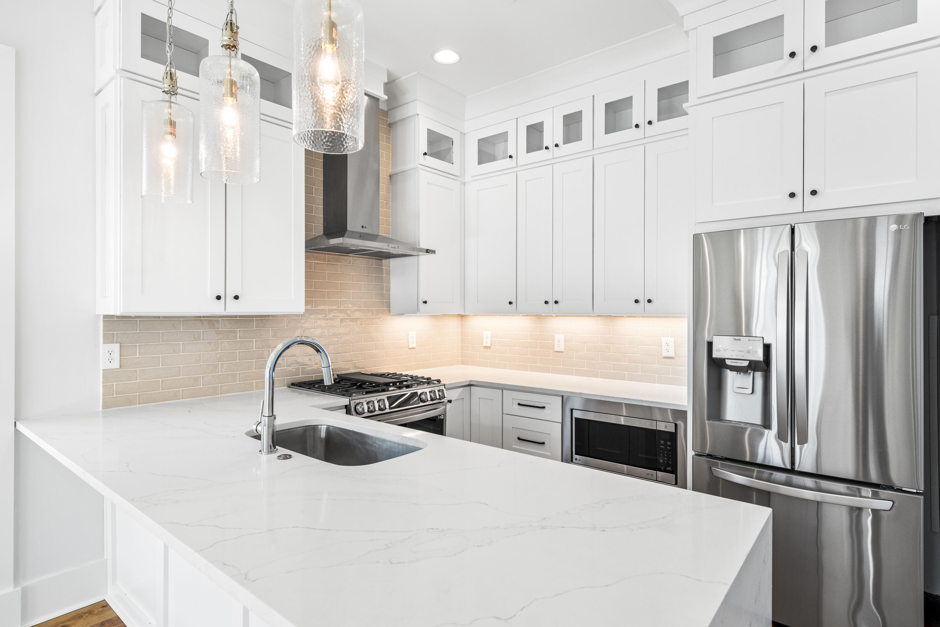 20 Casa Breeze Lane, Unit 20B Santa Rosa Beach, FL 32459 - Photo 6 of 41 a kitchen with stainless steel appliances a sink a stove a refrigerator and cabinets