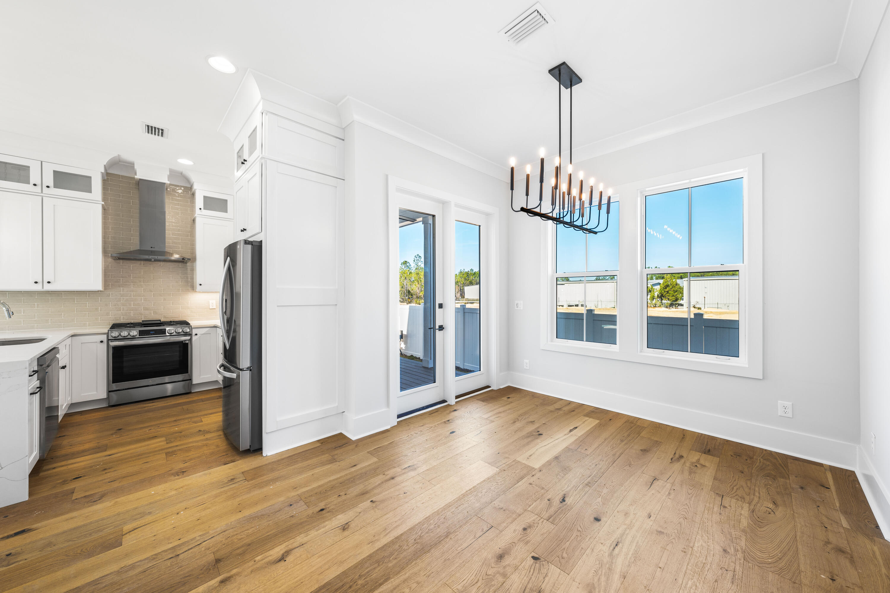 20 Casa Breeze Lane, Unit 20B Santa Rosa Beach, FL 32459 - Photo 9 of 41 a view of a kitchen with wooden floor and a window