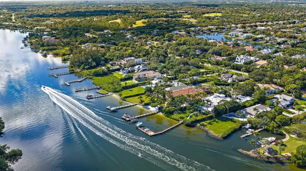 an aerial view of a house with a swimming pool