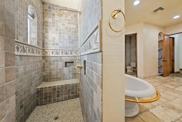 an aerial view of a house with a garden and swimming pool