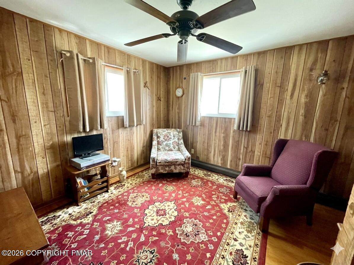 2319 Bear Town Road Canadensis, PA 18325 - Photo 17 of 31 a living room with furniture a flat screen tv and a window