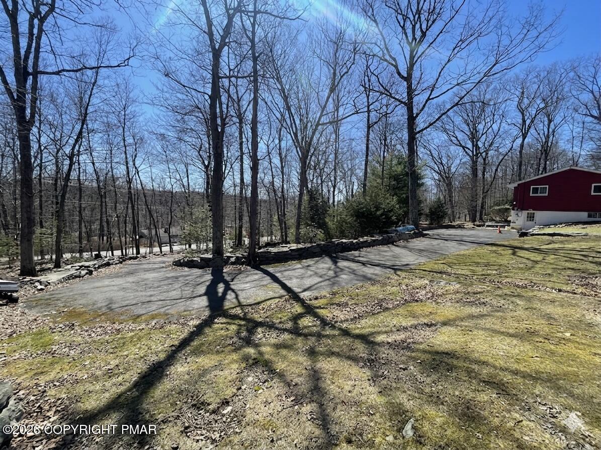 2319 Bear Town Road Canadensis, PA 18325 - Photo 26 of 31 a view of swimming pool with outdoor seating and trees
