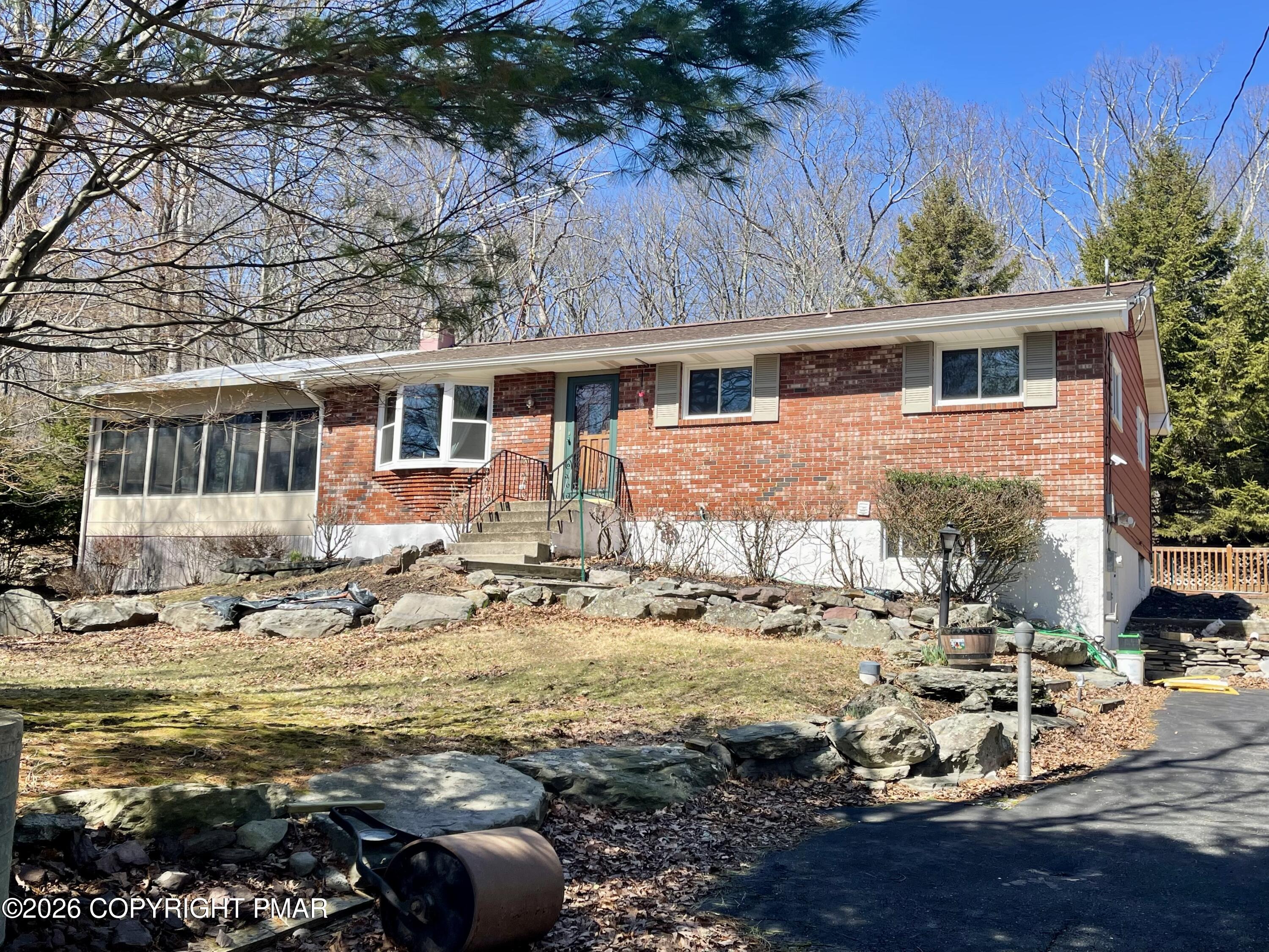 2319 Bear Town Road Canadensis, PA 18325 - Photo 30 of 31 a front view of a house with a yard
