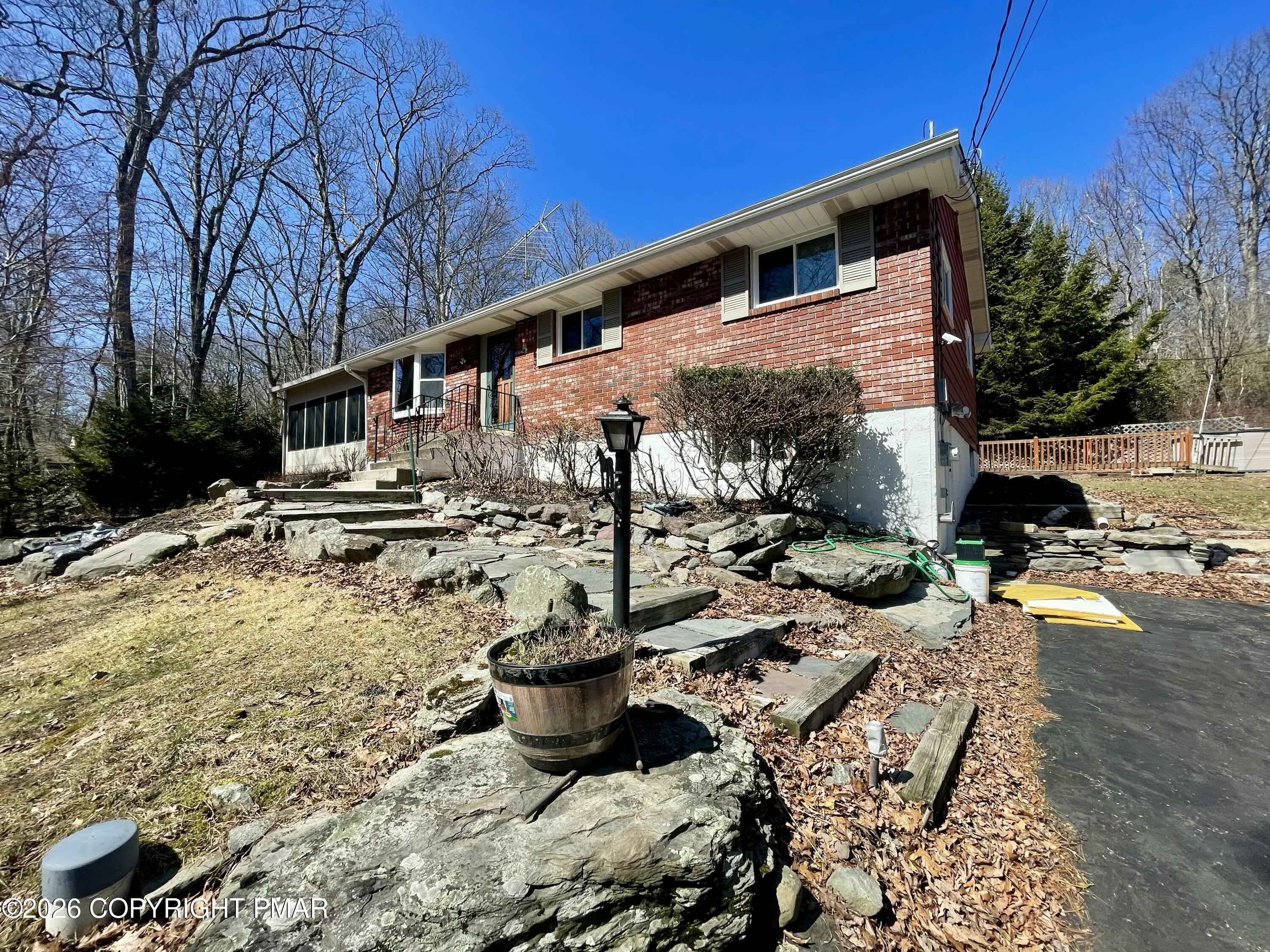2319 Bear Town Road Canadensis, PA 18325 - Photo 3 of 31 a view of a patio with table and chairs and potted plants