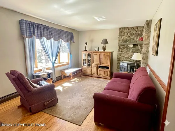 a living room with furniture and a large window