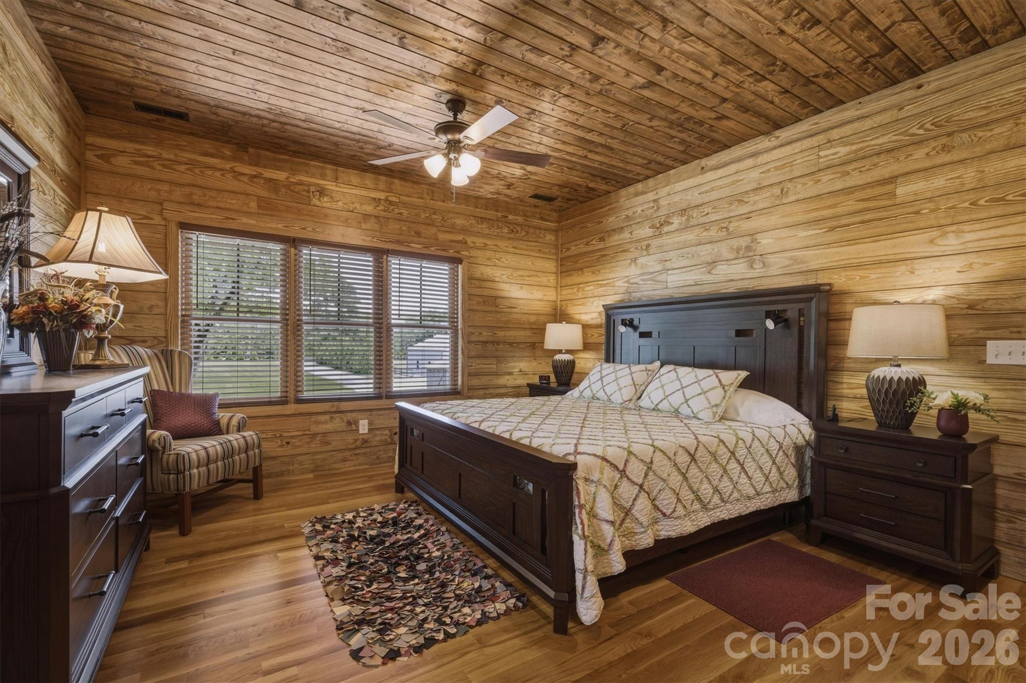 7490 Oak Ridge Church Road Connelly Springs, NC 28612 - Photo 25 of 44 a bedroom with a large bed and a large window
