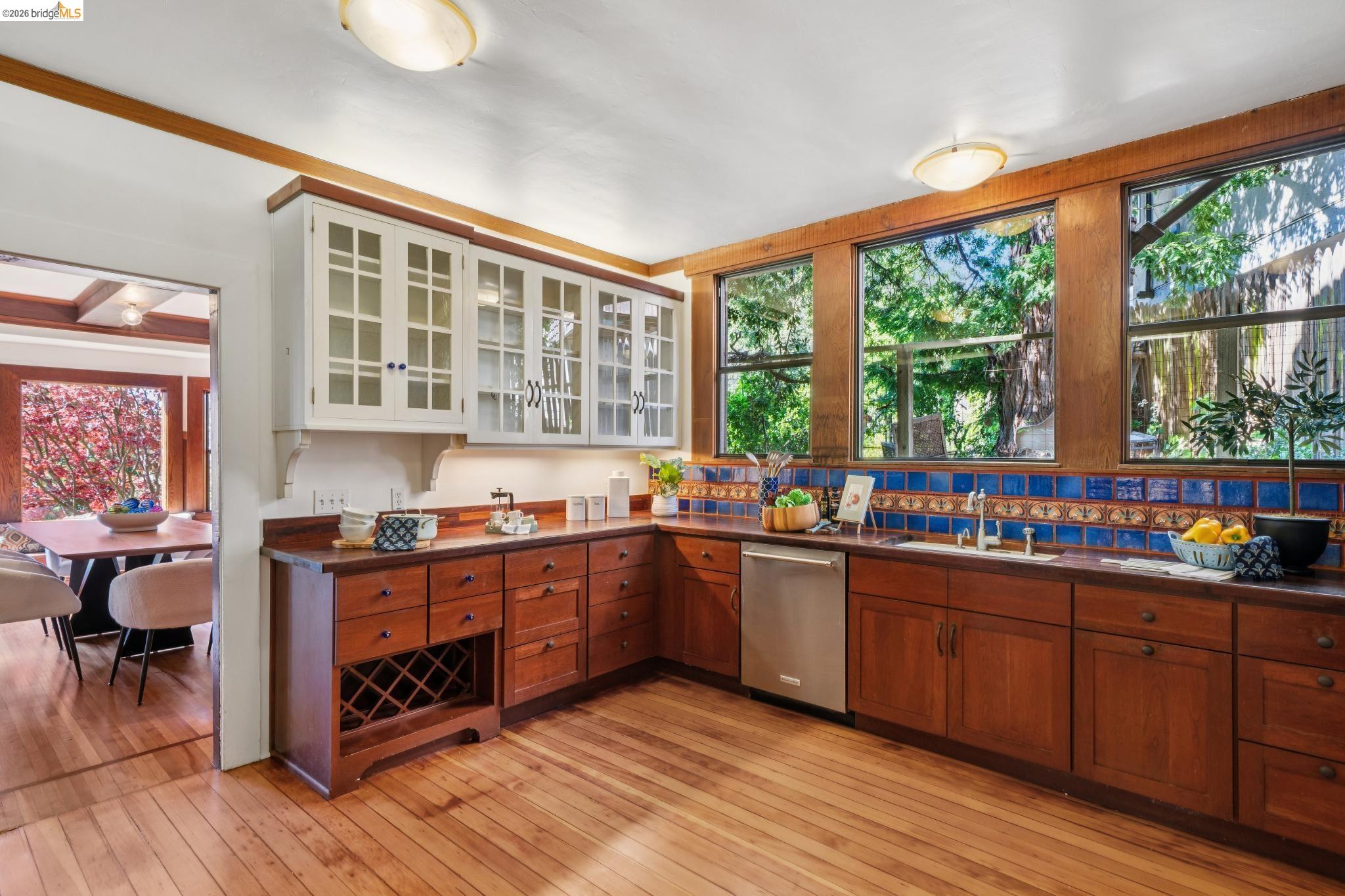 813 San Diego Road Berkeley, CA 94707 - Photo 20 of 60 a kitchen with lots of counter top space and wooden floor