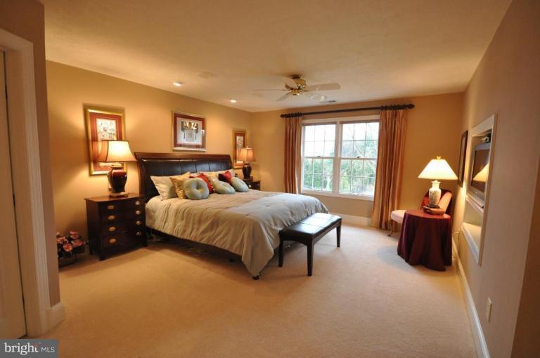 1214 Tottenham Court Reston, VA 20194 - Photo 6 of 13 a bedroom with a large bed and a window