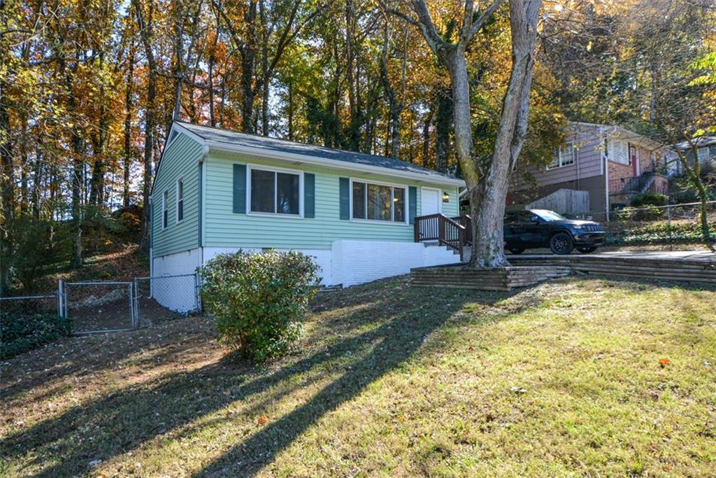 554 Alpine Way Marietta, GA 30062 - Photo 1 of 27 a front view of a house with garden