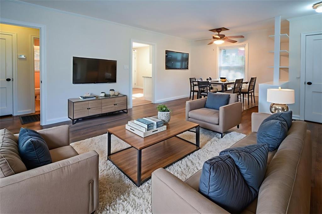 554 Alpine Way Marietta, GA 30062 - Photo 11 of 27 a living room with furniture and a flat screen tv