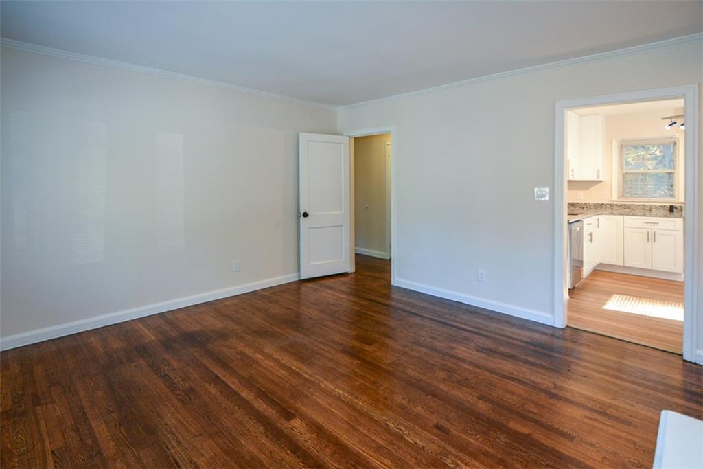 554 Alpine Way Marietta, GA 30062 - Photo 12 of 27 a view of an empty room with wooden floor and a window