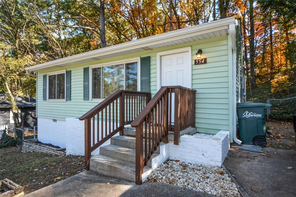 554 Alpine Way Marietta, GA 30062 - Photo 2 of 27 a view of a house with wooden floor and a large tree