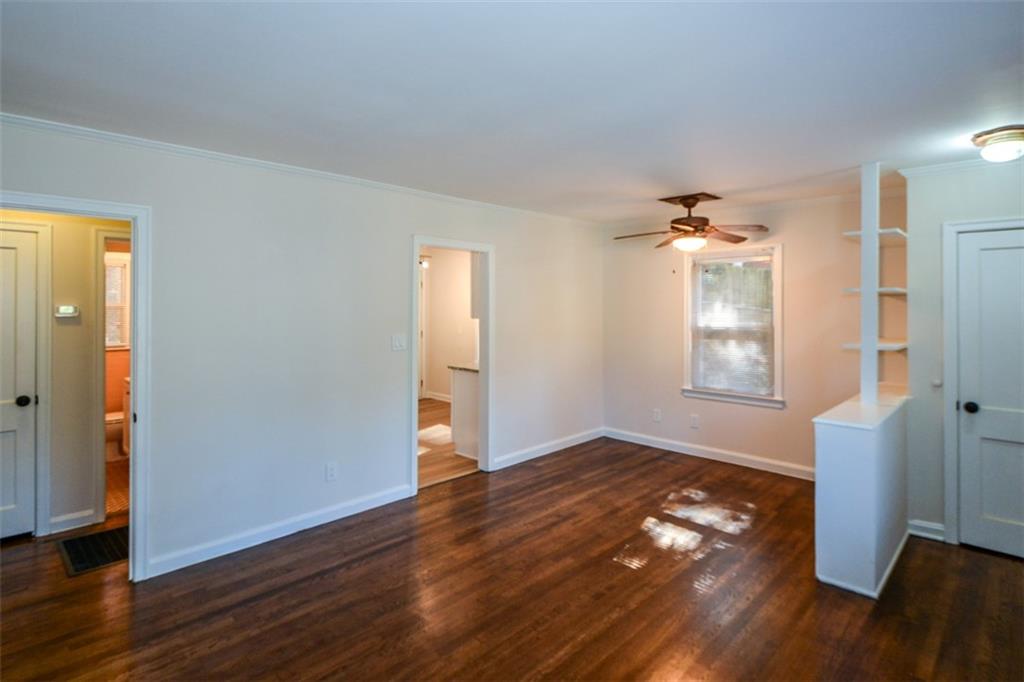 554 Alpine Way Marietta, GA 30062 - Photo 27 of 27 an empty room with wooden floor and windows