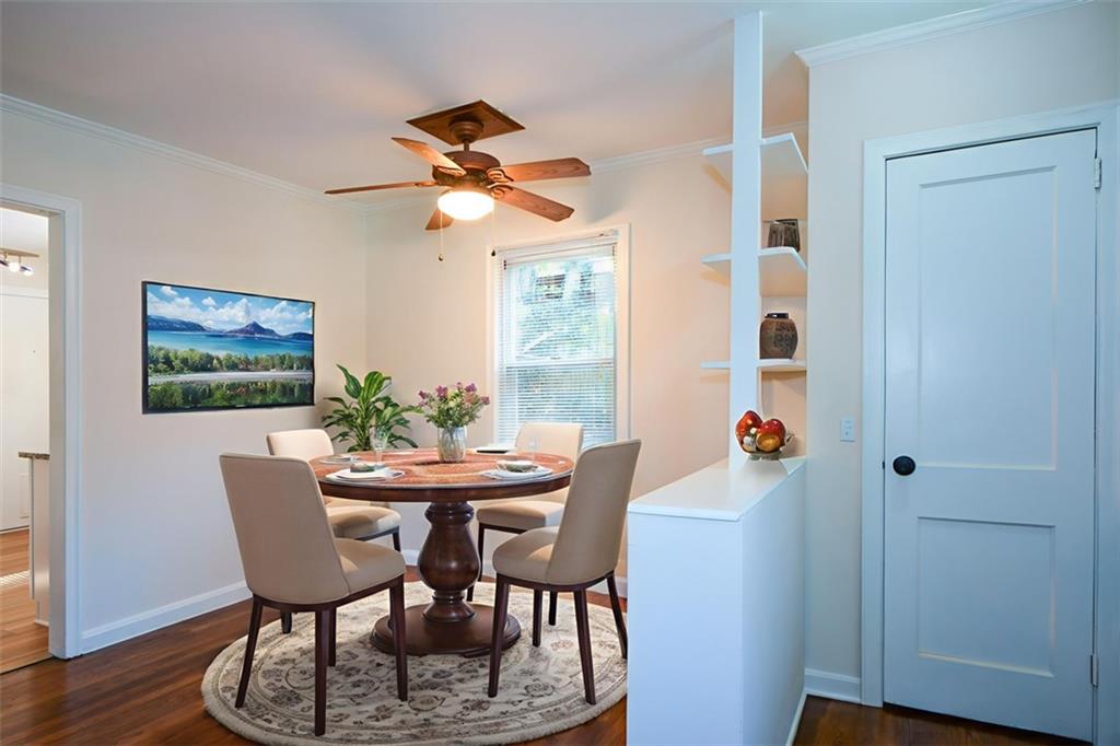 554 Alpine Way Marietta, GA 30062 - Photo 5 of 27 a dining room with furniture a window and wooden floor