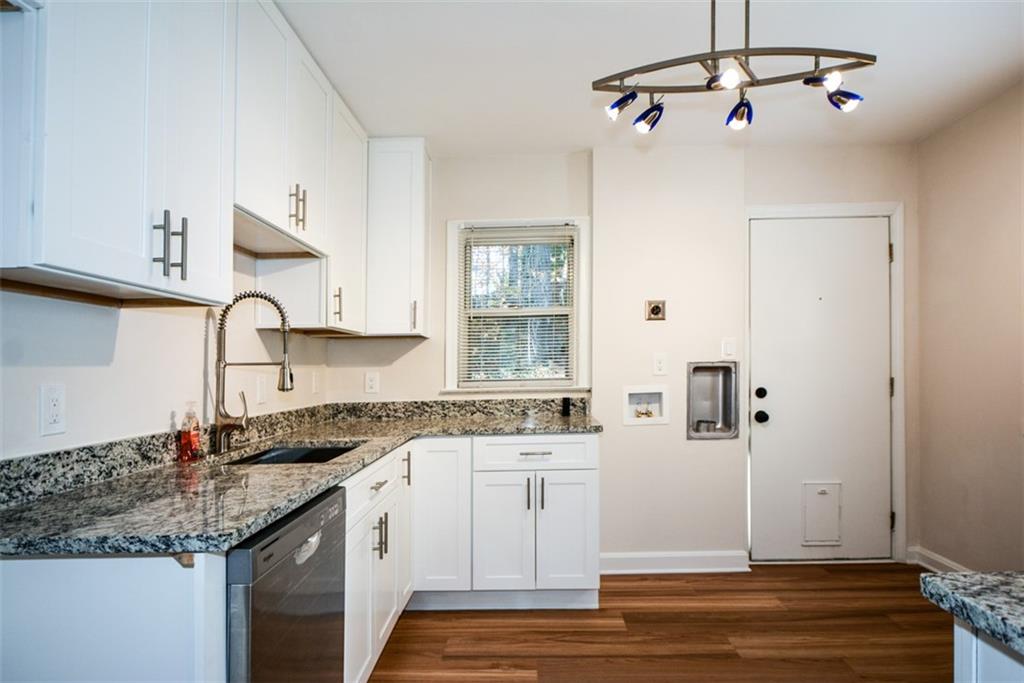 554 Alpine Way Marietta, GA 30062 - Photo 7 of 27 a kitchen with a sink cabinets and window