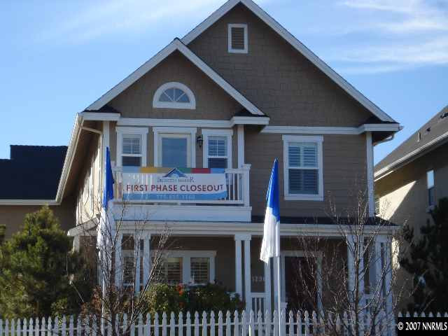 a front view of a house with a small yard