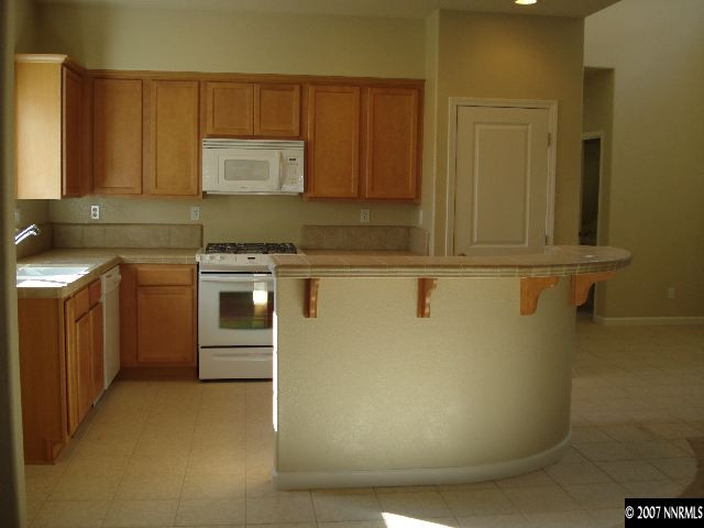 3290 Paragon Place Reno, NV 89509 - Photo 4 of 8 a utility room with washer and dryer