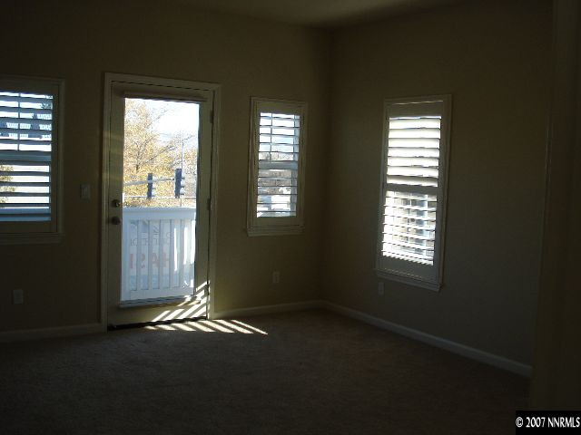 3290 Paragon Place Reno, NV 89509 - Photo 6 of 8 an empty room with a empty space and windows
