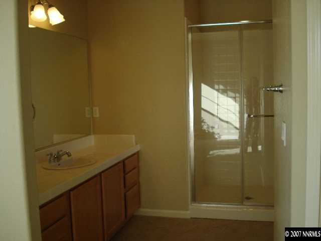 3290 Paragon Place Reno, NV 89509 - Photo 7 of 8 a bathroom with a shower and sink