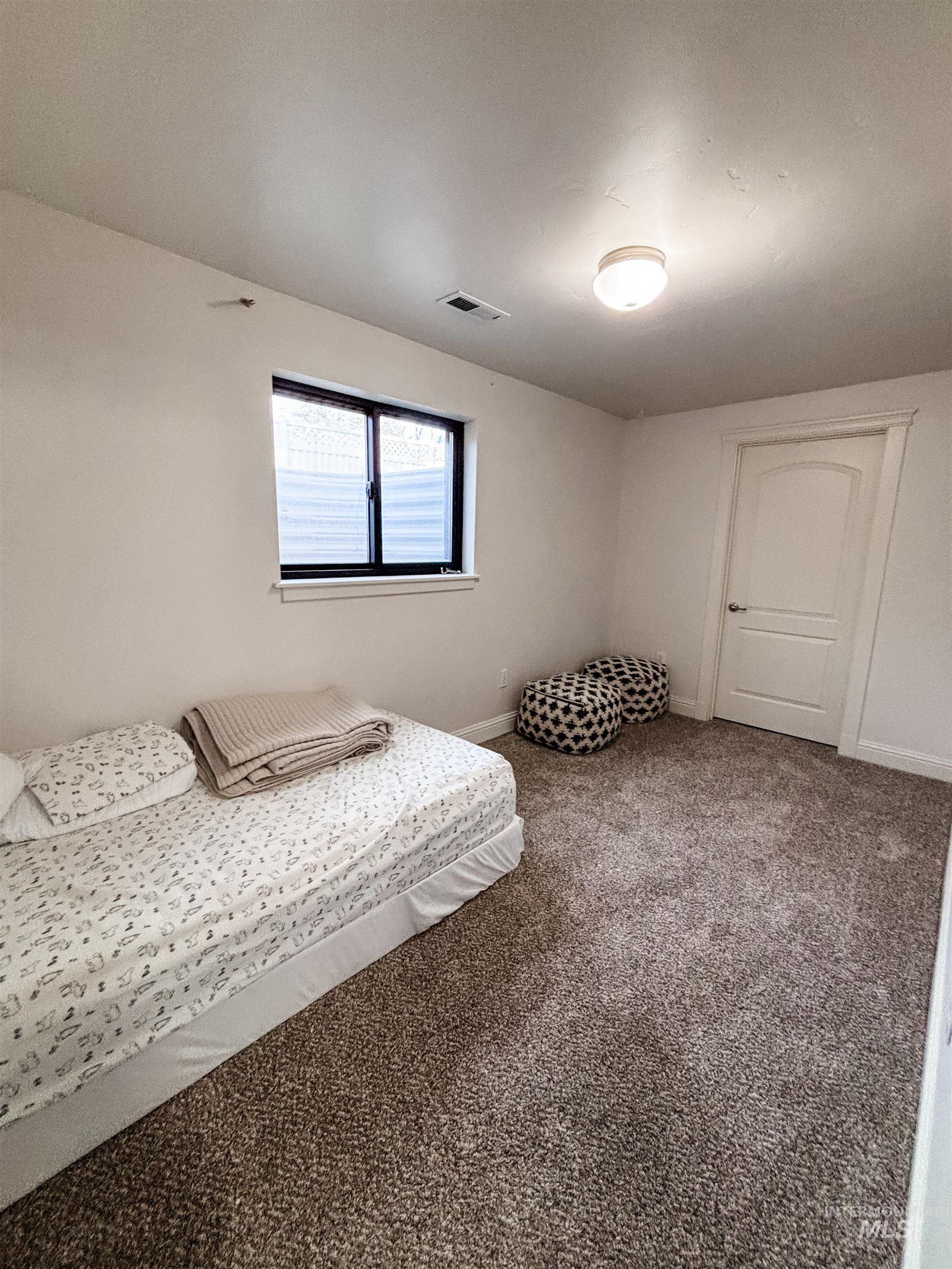 743 North Horseshoe Bend Road Eagle, ID 83616 - Photo 14 of 27 Carpeted bedroom with baseboards