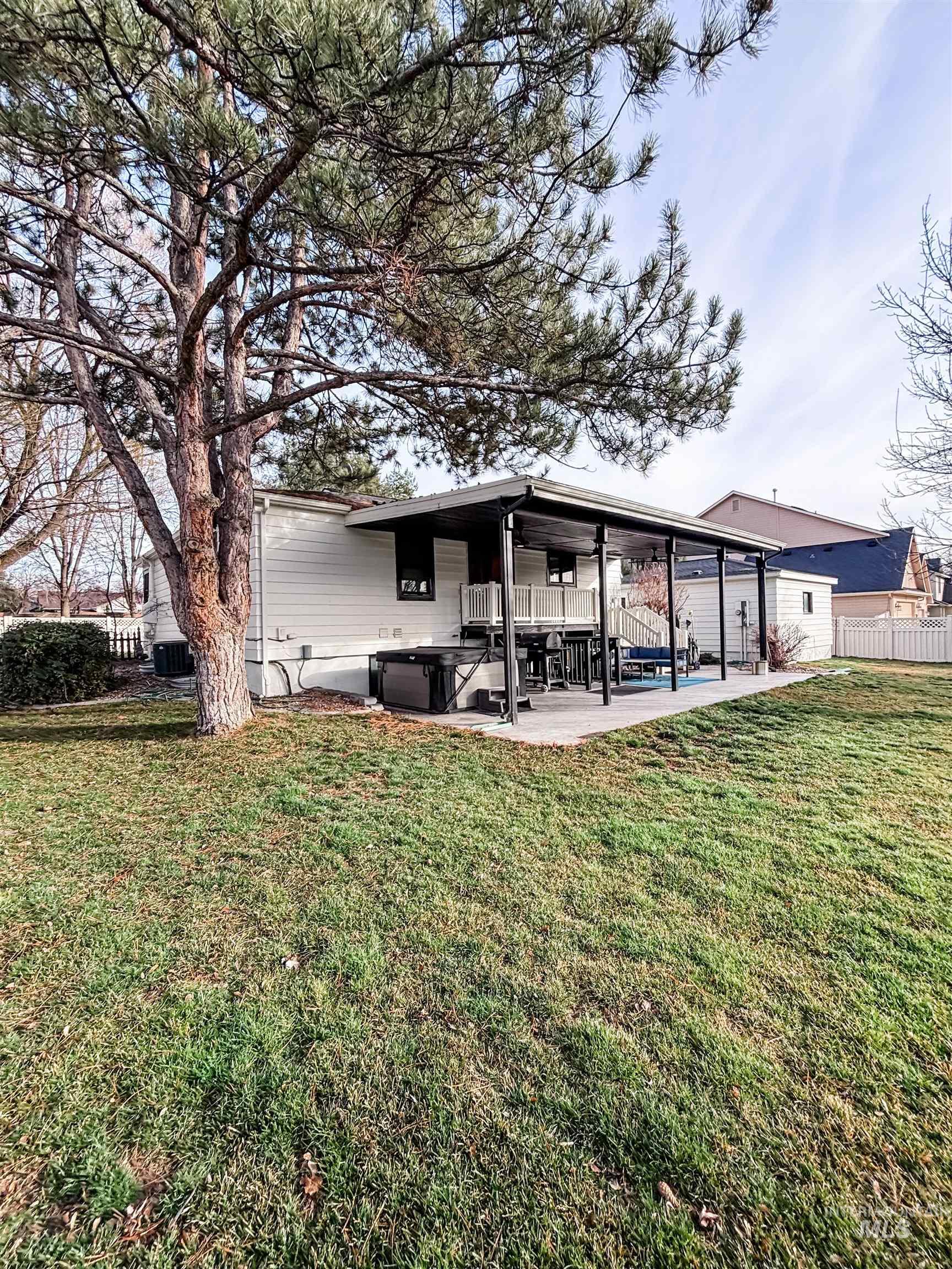 743 North Horseshoe Bend Road Eagle, ID 83616 - Photo 25 of 27 Back of house with a patio