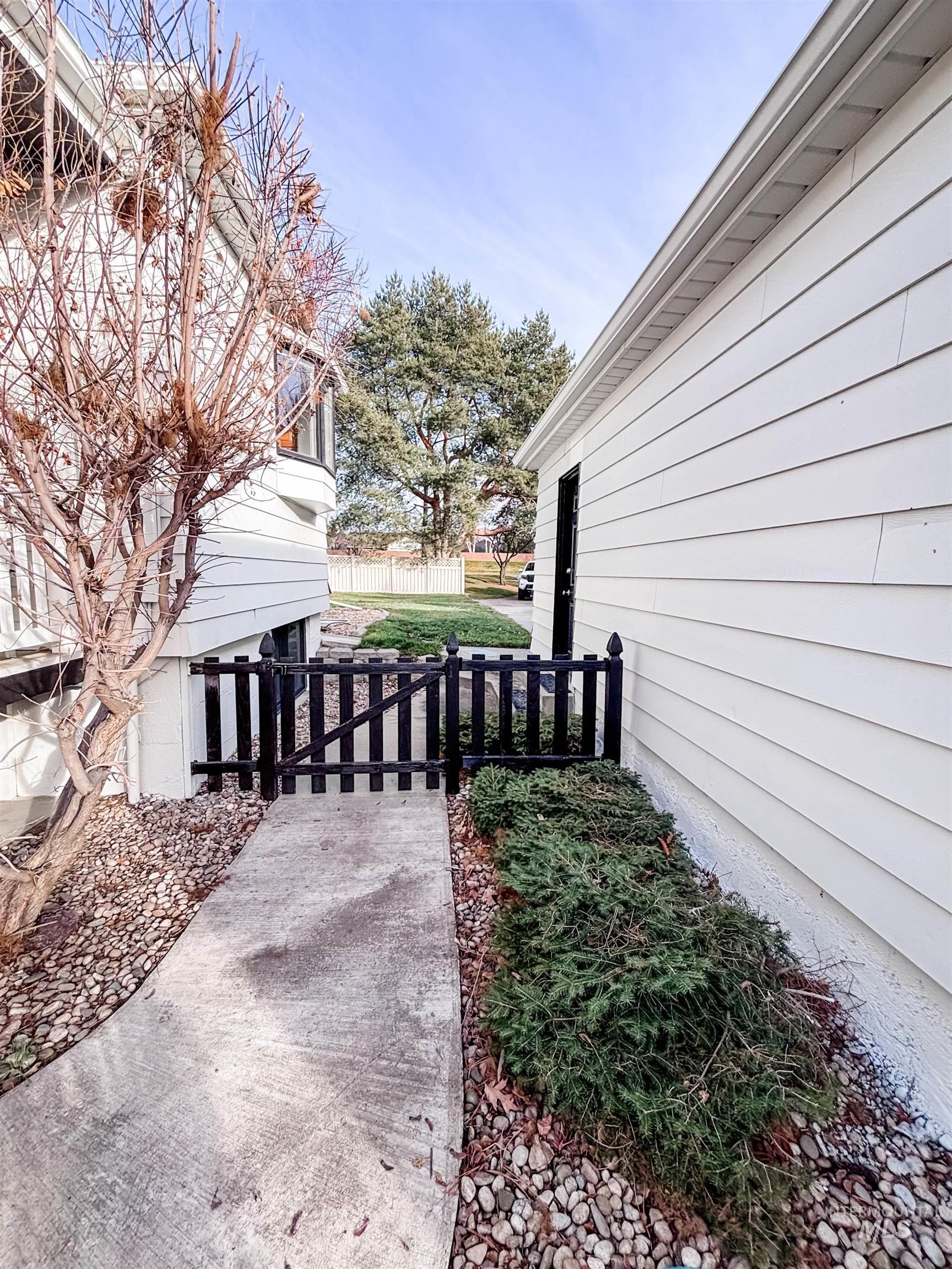 743 North Horseshoe Bend Road Eagle, ID 83616 - Photo 26 of 27 View of home's exterior featuring a gate