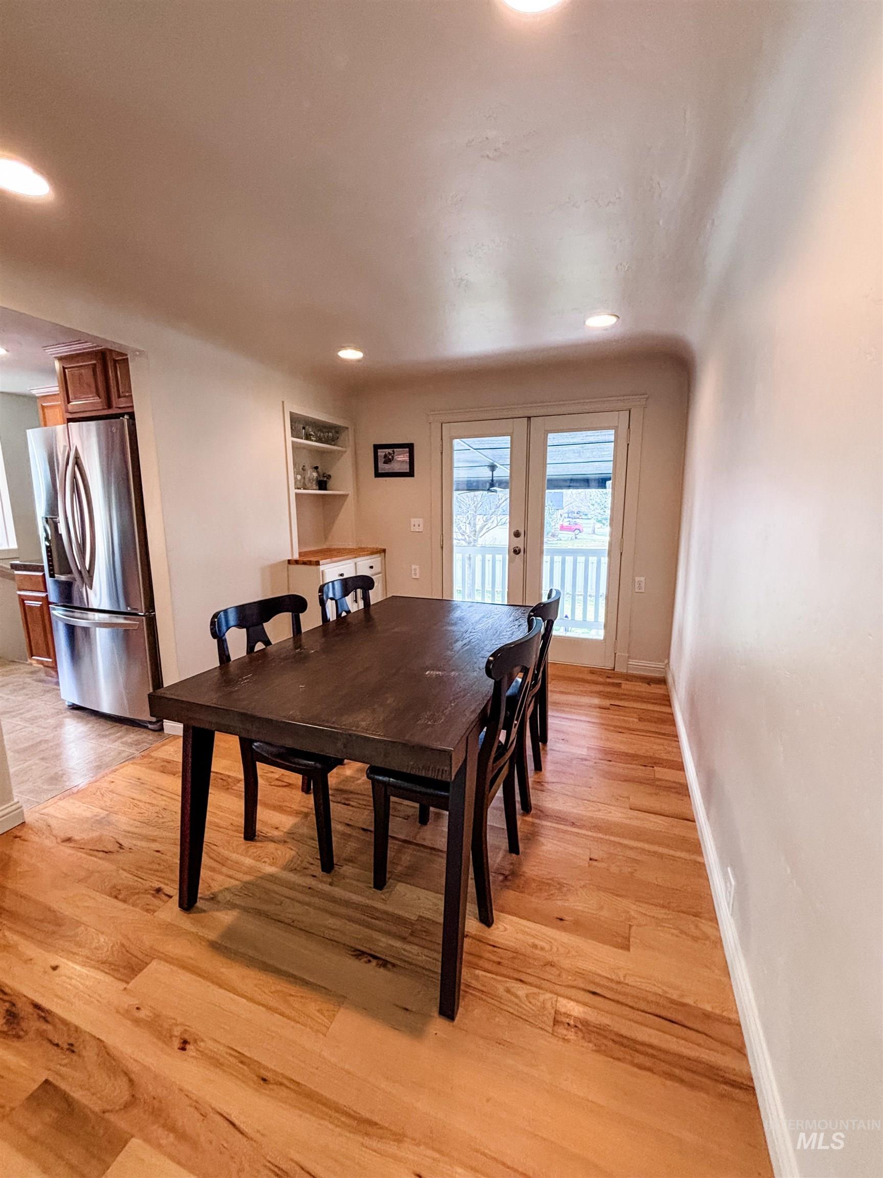 743 North Horseshoe Bend Road Eagle, ID 83616 - Photo 9 of 27 Dining area with french doors, light wood-type flooring, and recessed lighting