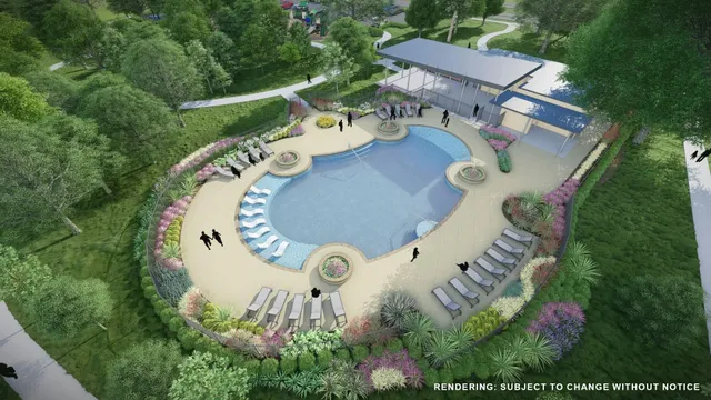 an aerial view of a house with a swimming pool and outdoor space