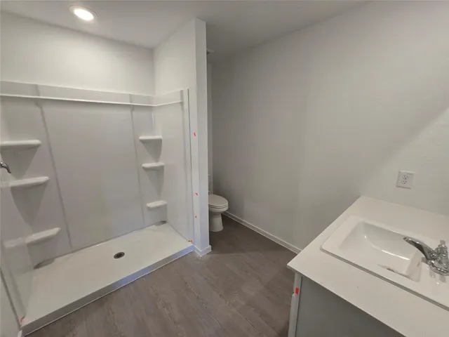 a bathroom with a sink and a shower