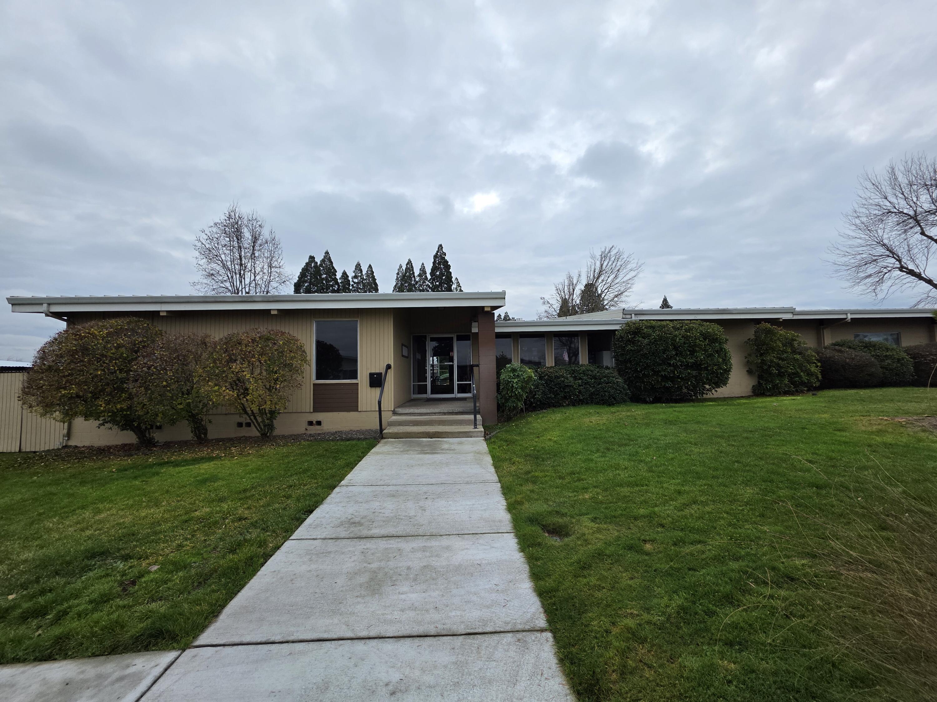 301 Freeman Road, Unit 30 Central Point, OR 97502 - Photo 21 of 26 a front view of a house with a yard