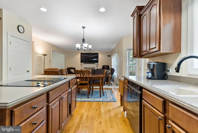 a kitchen with stainless steel appliances a sink stove and cabinets