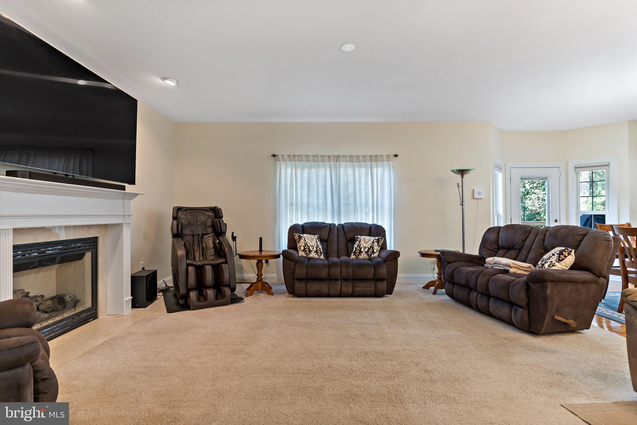 33 Caesar Road Harpers Ferry, WV 25425 - Photo 22 of 47 a living room with furniture a flat screen tv and a fireplace