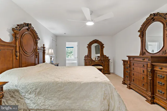 a bedroom with a bed and a dresser