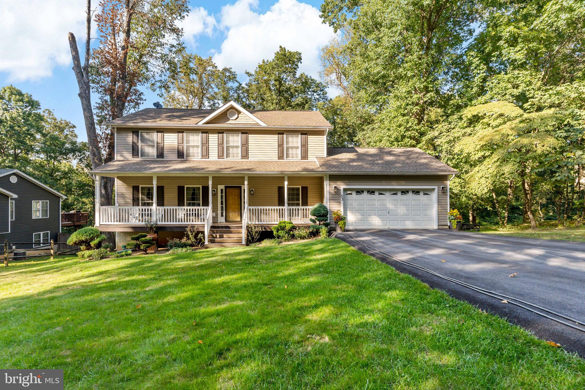 33 Caesar Road Harpers Ferry, WV 25425 - Photo 41 of 47 a front view of a house with a garden