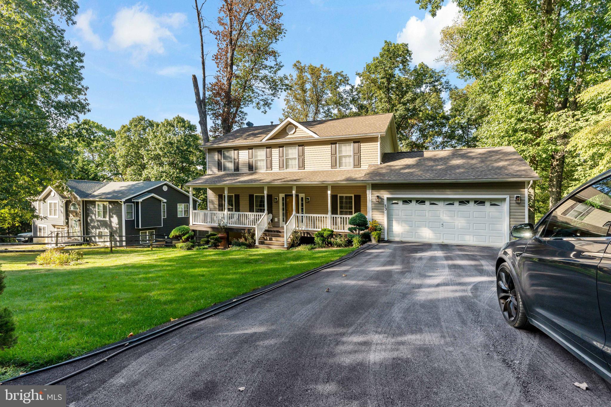 33 Caesar Road Harpers Ferry, WV 25425 - Photo 43 of 47 a front view of a house with a yard table and chairs