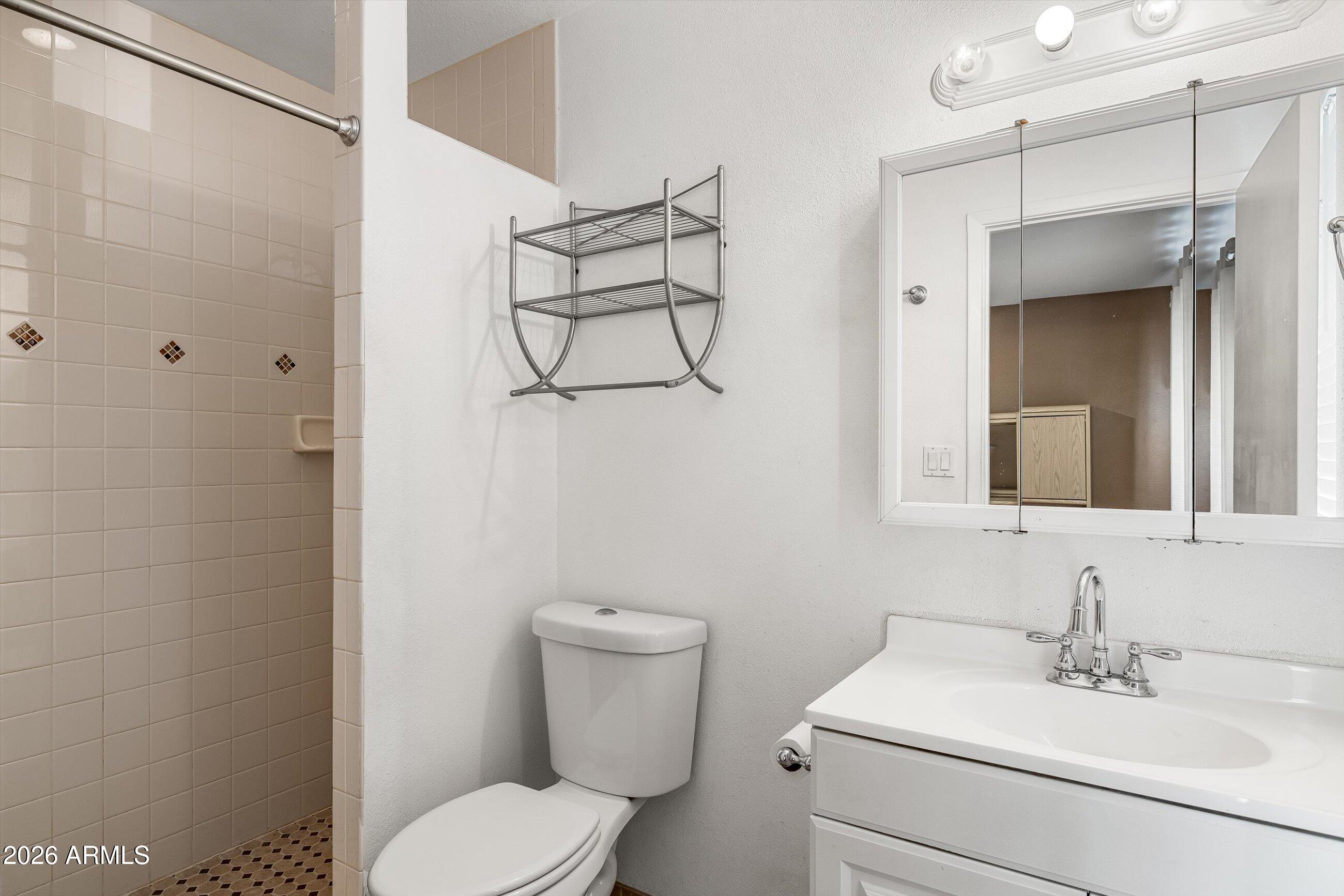 3024 West Wagoner Road Phoenix, AZ 85053 - Photo 13 of 34 a bathroom with a sink toilet and shower