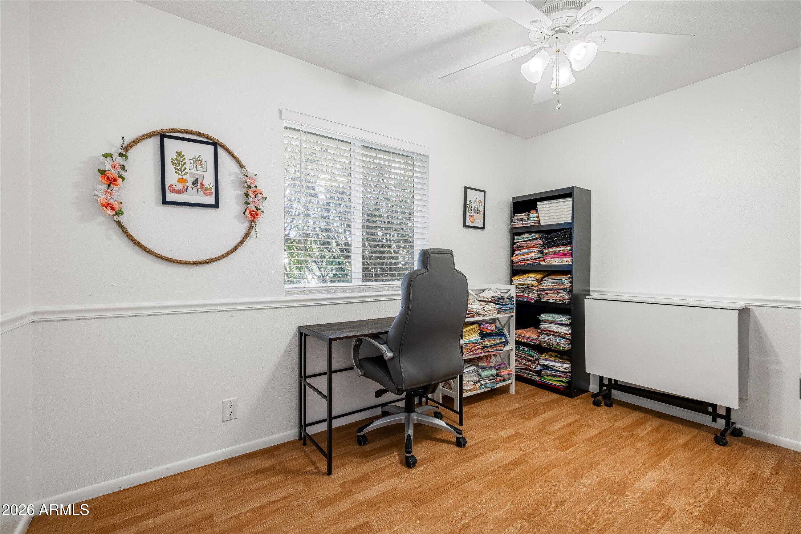 3024 West Wagoner Road Phoenix, AZ 85053 - Photo 14 of 34 a view of a workspace with furniture and a window