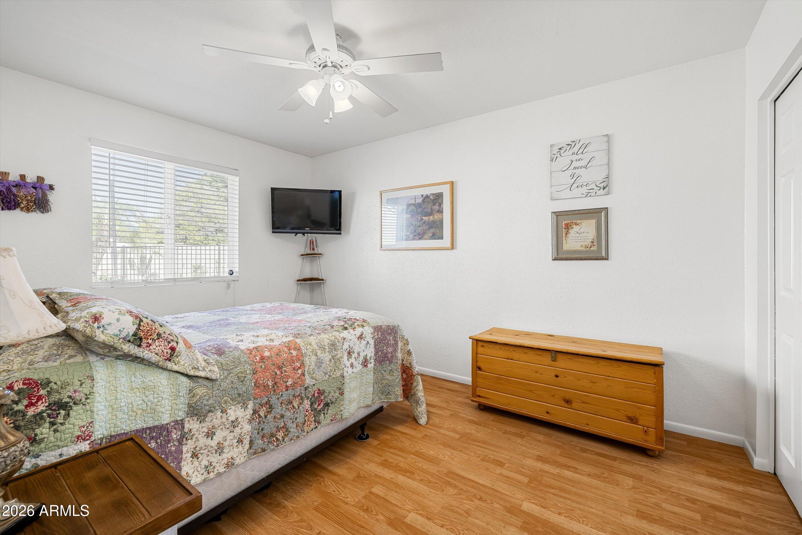 3024 West Wagoner Road Phoenix, AZ 85053 - Photo 15 of 34 a bedroom with a bed and a flat screen tv