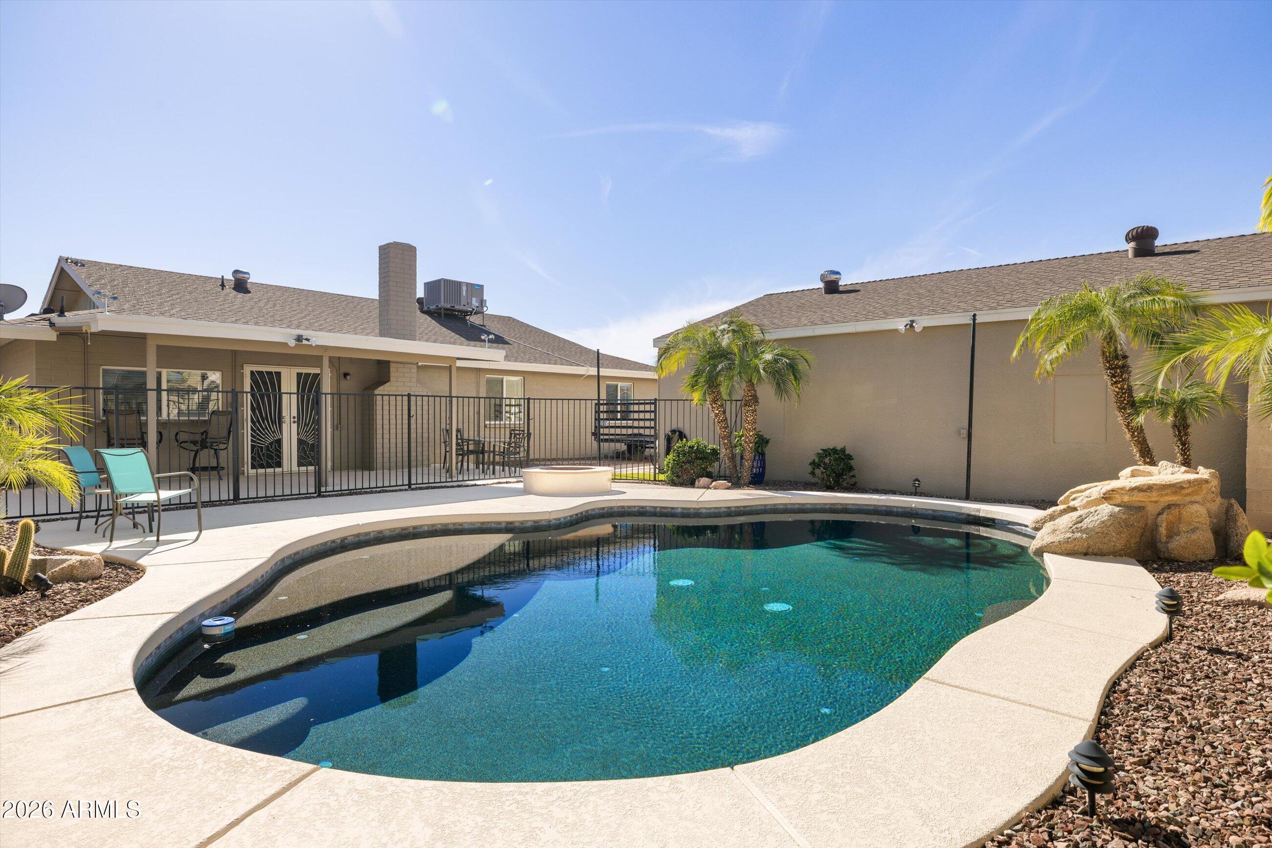3024 West Wagoner Road Phoenix, AZ 85053 - Photo 20 of 34 a view of a house with swimming pool and a porch